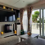 Sunset Retreat Caravan With Large Wrap Around Decking